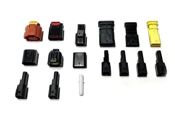 Assorted Ford harness plug kit connectors in orange, black and yellow