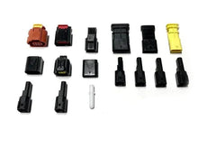 Assorted Ford harness plug kit connectors in orange, black and yellow